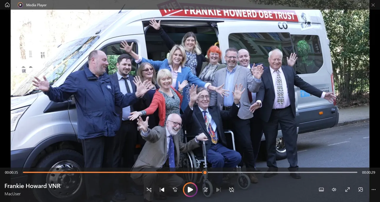 Trust representatives and local supporters gathered beside the community minibus