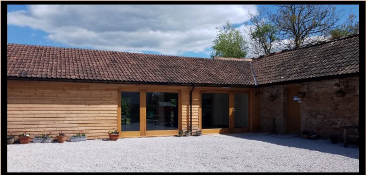 The stone café and timber-clad Dame June Whitfield Centre around the courtyard in Loxton