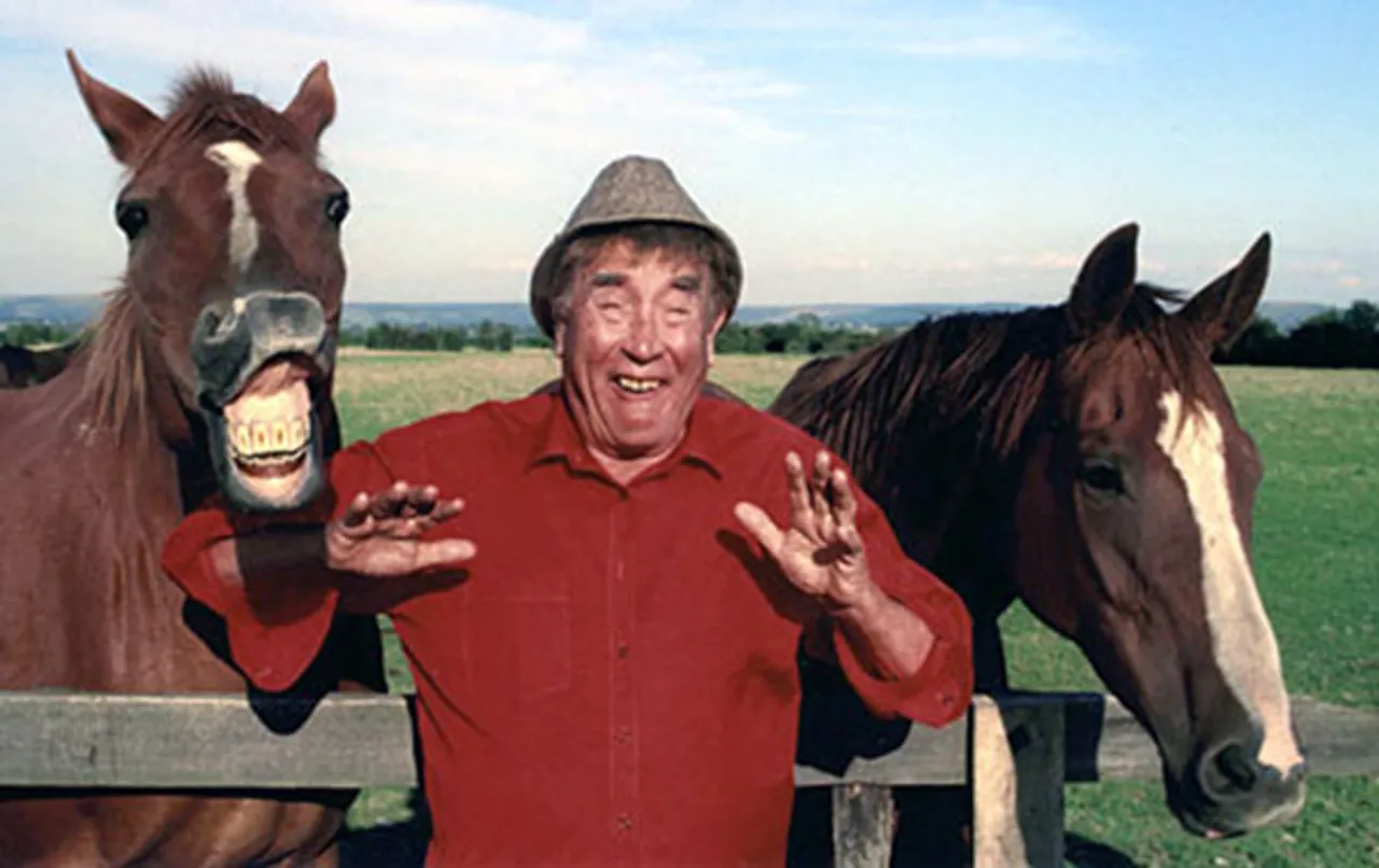 Frankie Howerd with two horses