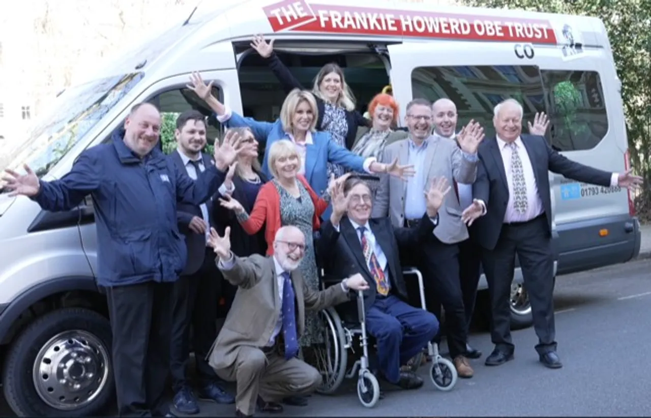 Dame Joanna Lumley, Suzy Aitchison and supporters with the new minibus